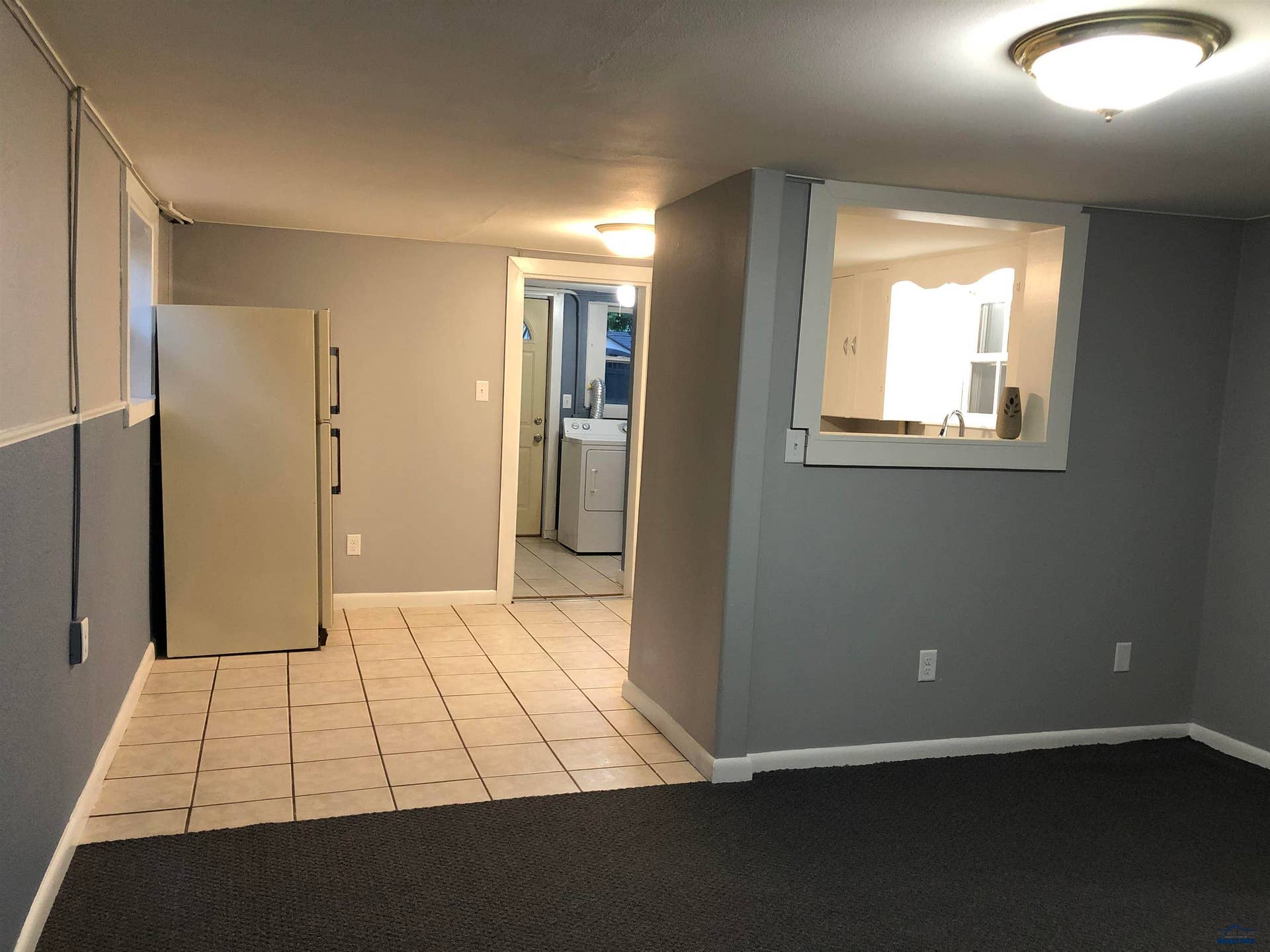 Refrigerator in kitchen also conveys