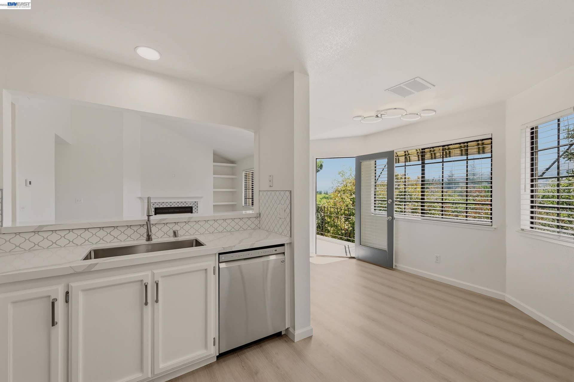 Kitchen and Dining Room with Balcony Door Open