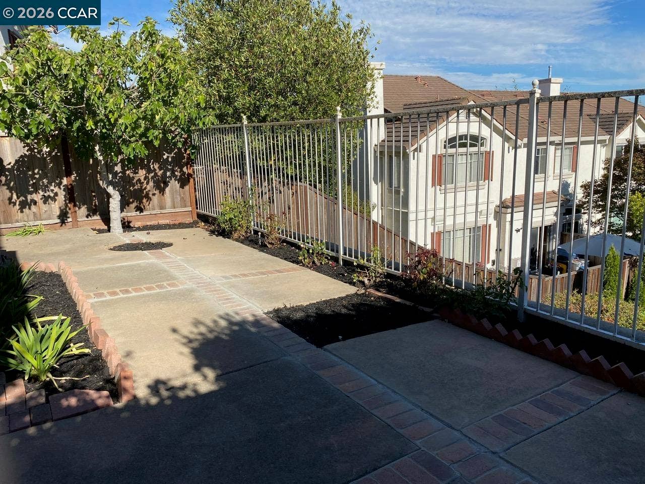 Patio with roses and fruit trees