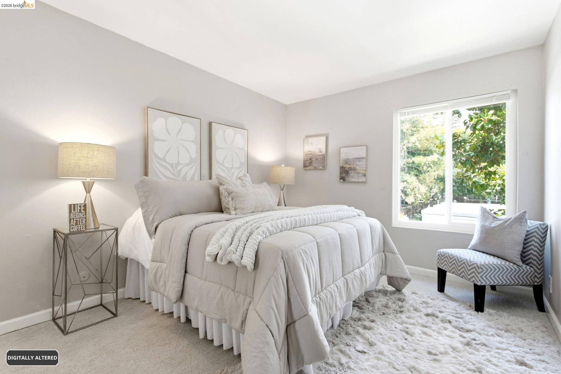 Carpeted bedroom featuring neutral wall paint, a large window, white baseboards, and overhead lighting