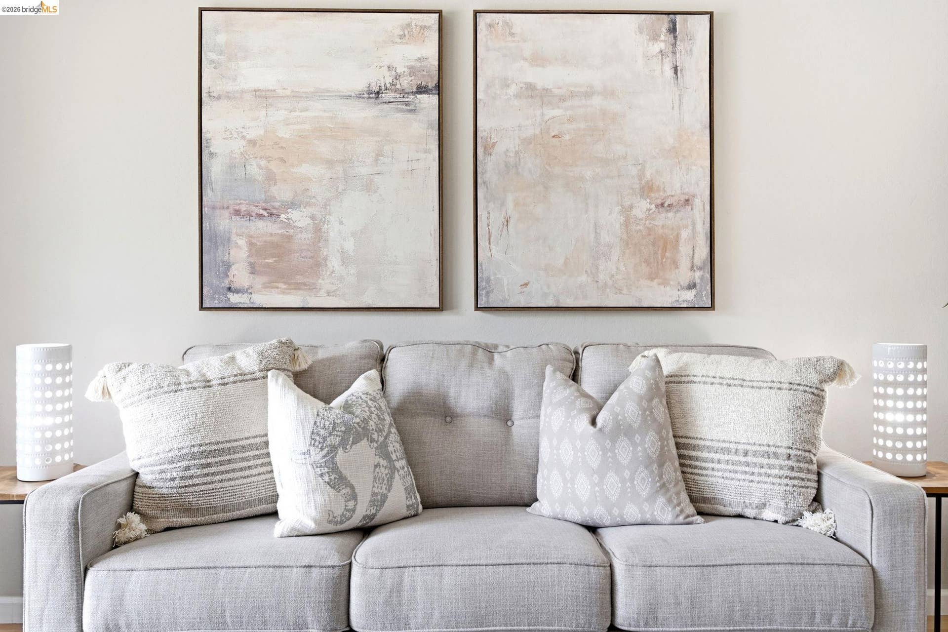White wall space with two framed abstract art pieces