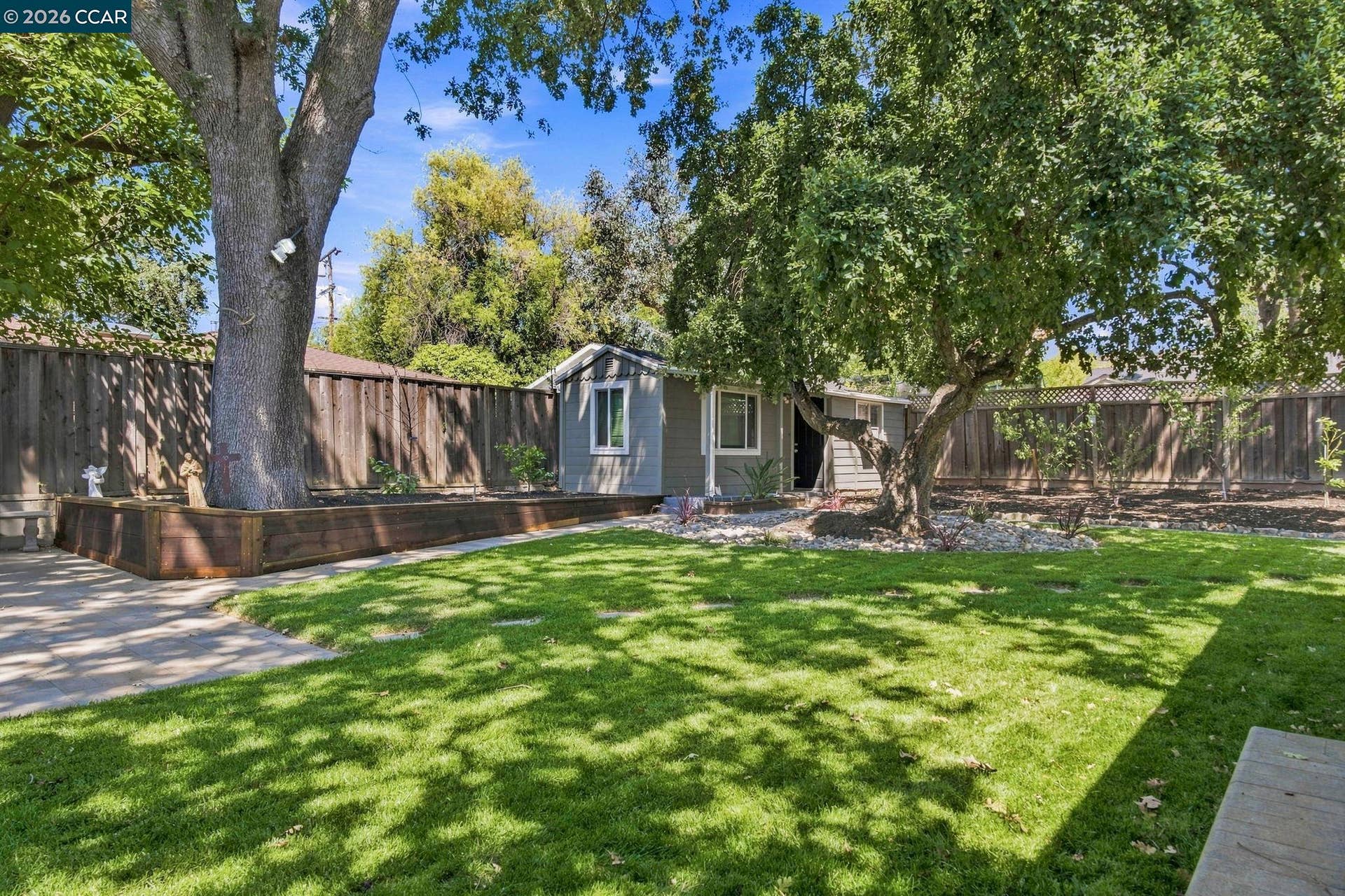 Lush level lawns in this private backyard oasis!