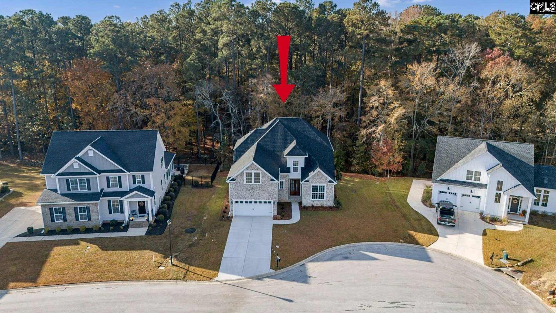 Ideally positioned on a quiet cul-de-sac lot with a wooded backdrop for added privacy.