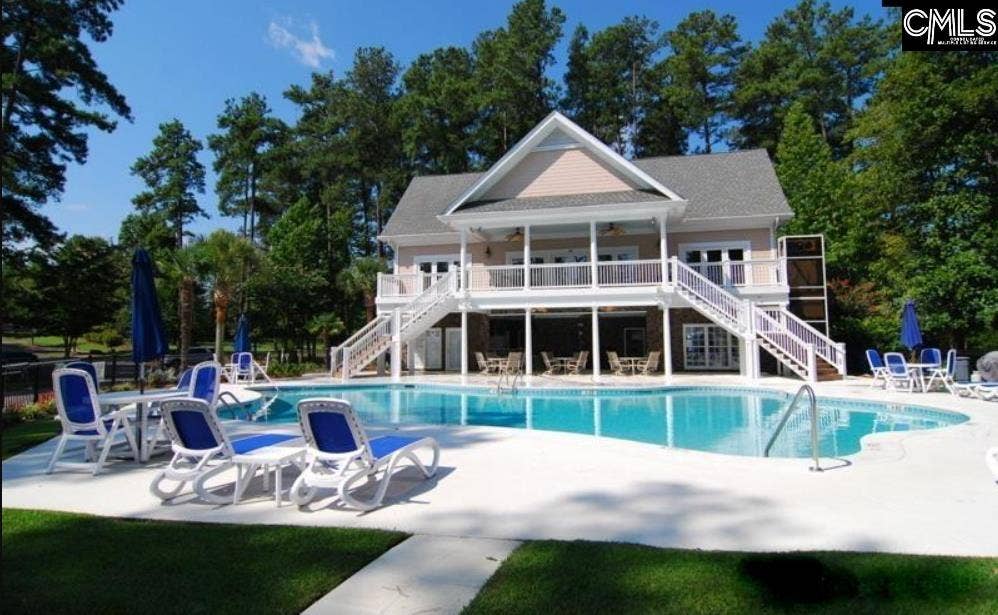 Community pool and clubhouse offer relaxing setting for swimming, gathering and enjoying sunny days.