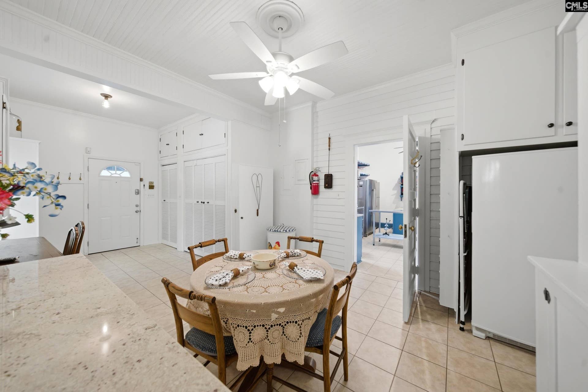 Holds the laundry, extra storage, additional fridge and freezer, and coffee bar.
