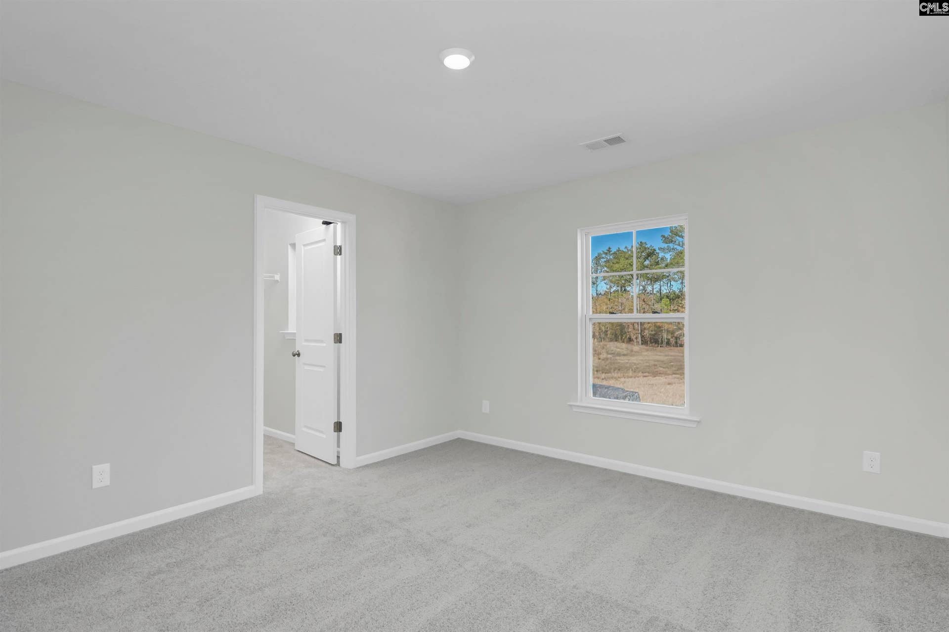 large walk in closet with window