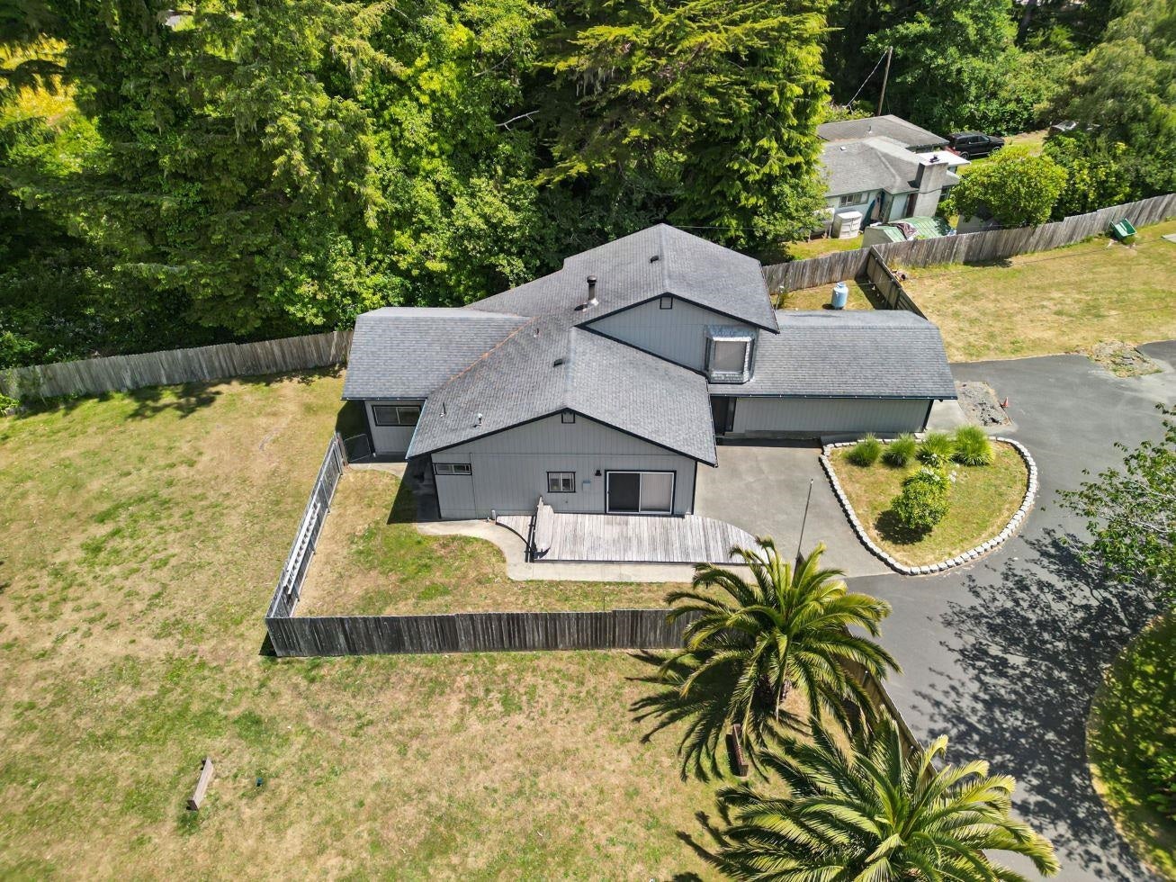 This is a 2-story home on one acre being sold with 2 other homes that are on 2.13 acres,