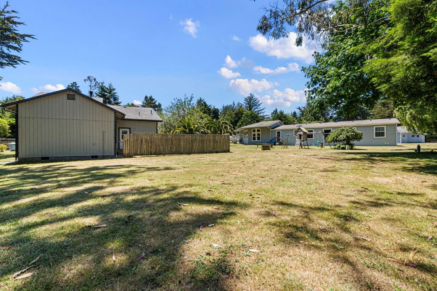 See main house beyond rear view of the 2-story.