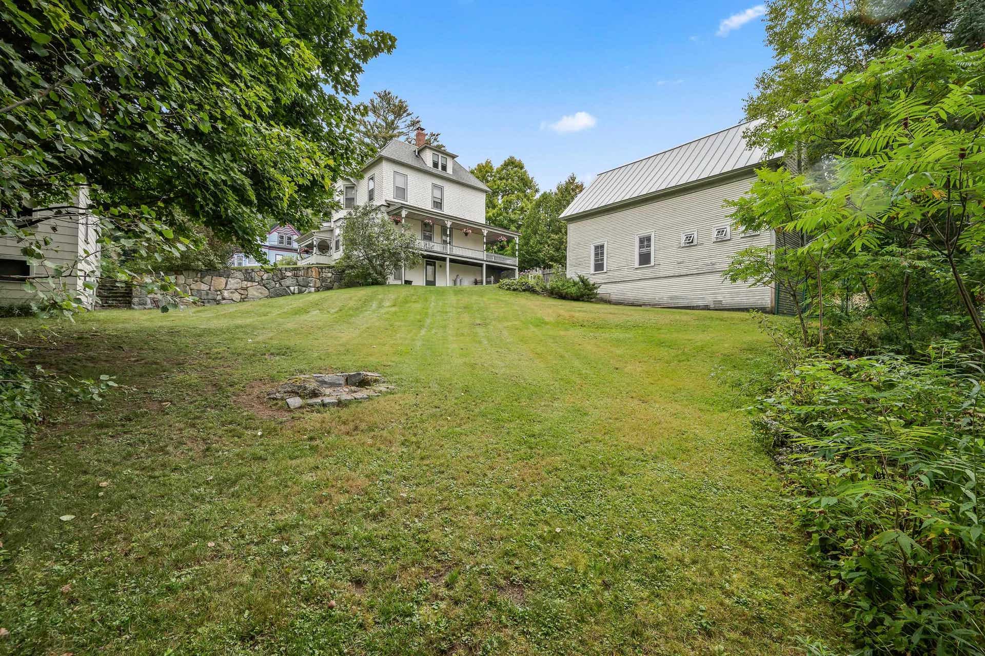 Backyard looking at Rear of House and Carriage House