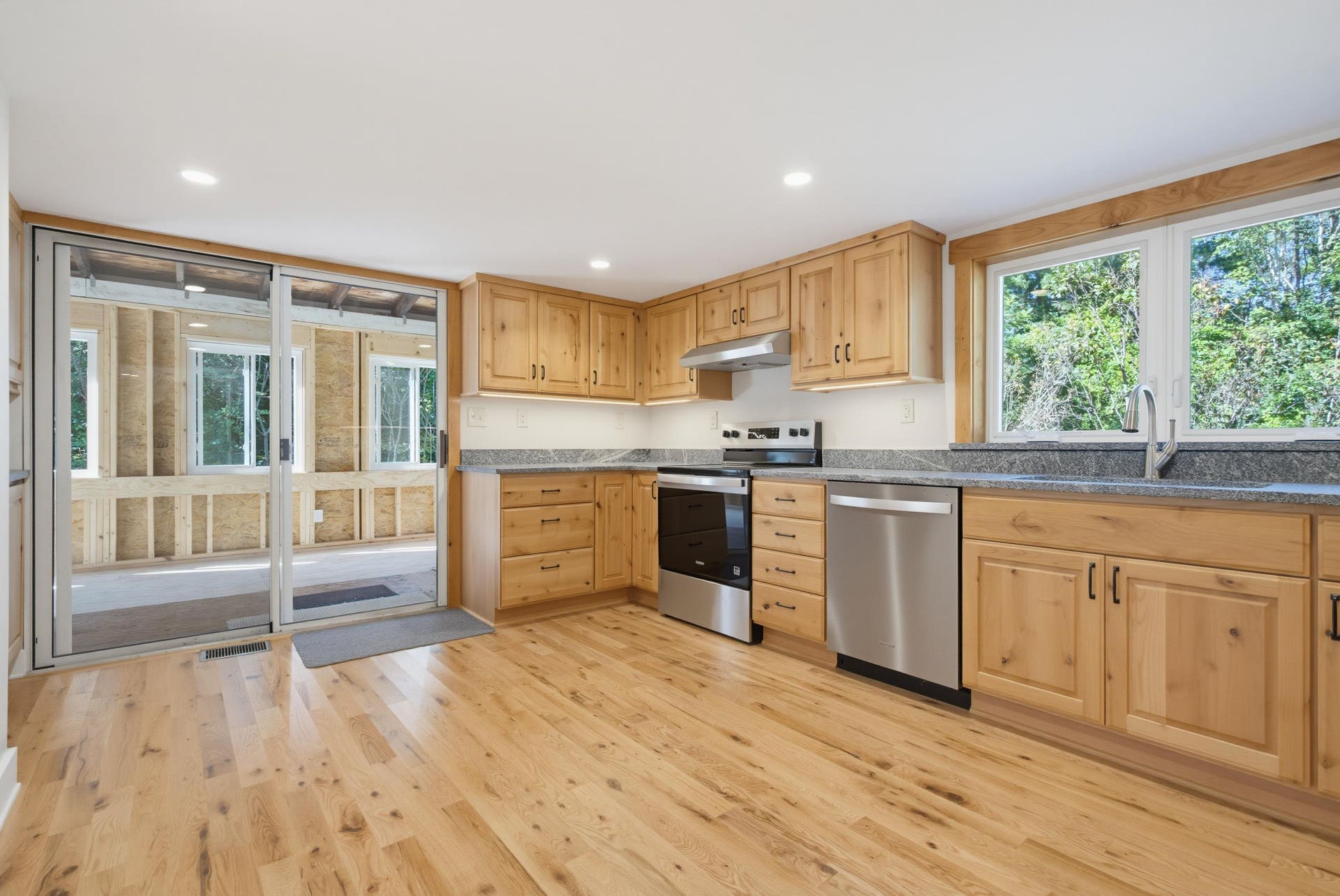 Kitchen with view of 3 season room
