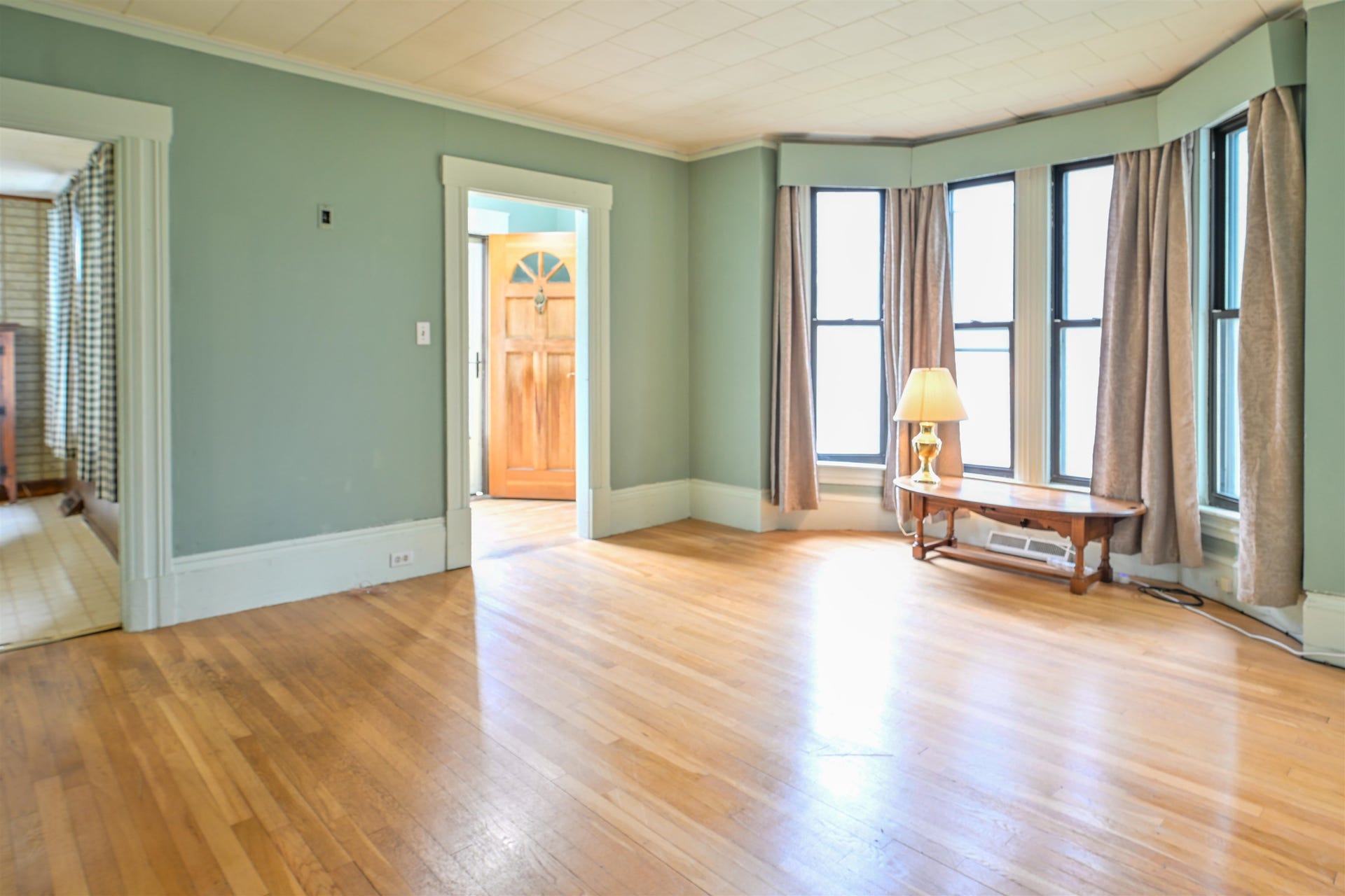 Living room with bright bay window
