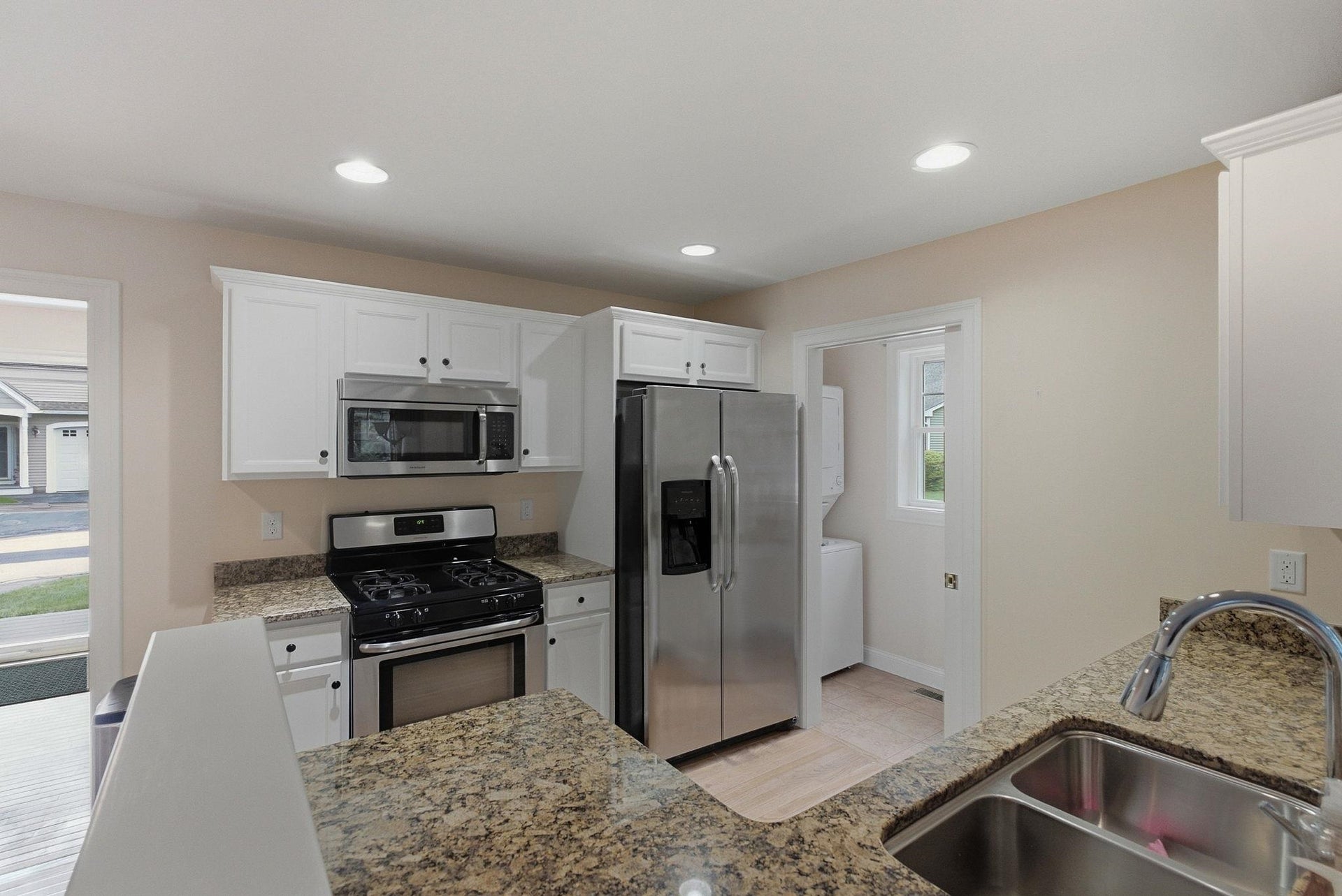 Newer painted cabinets with stainless steel appliances